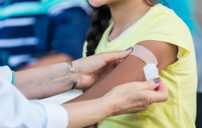 Nurse applying bandage