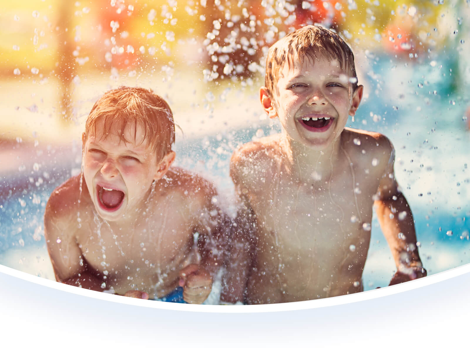 Two boys playing in water.