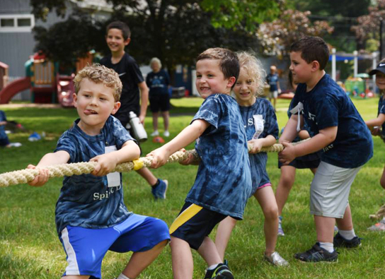 Kids playing tug of war.