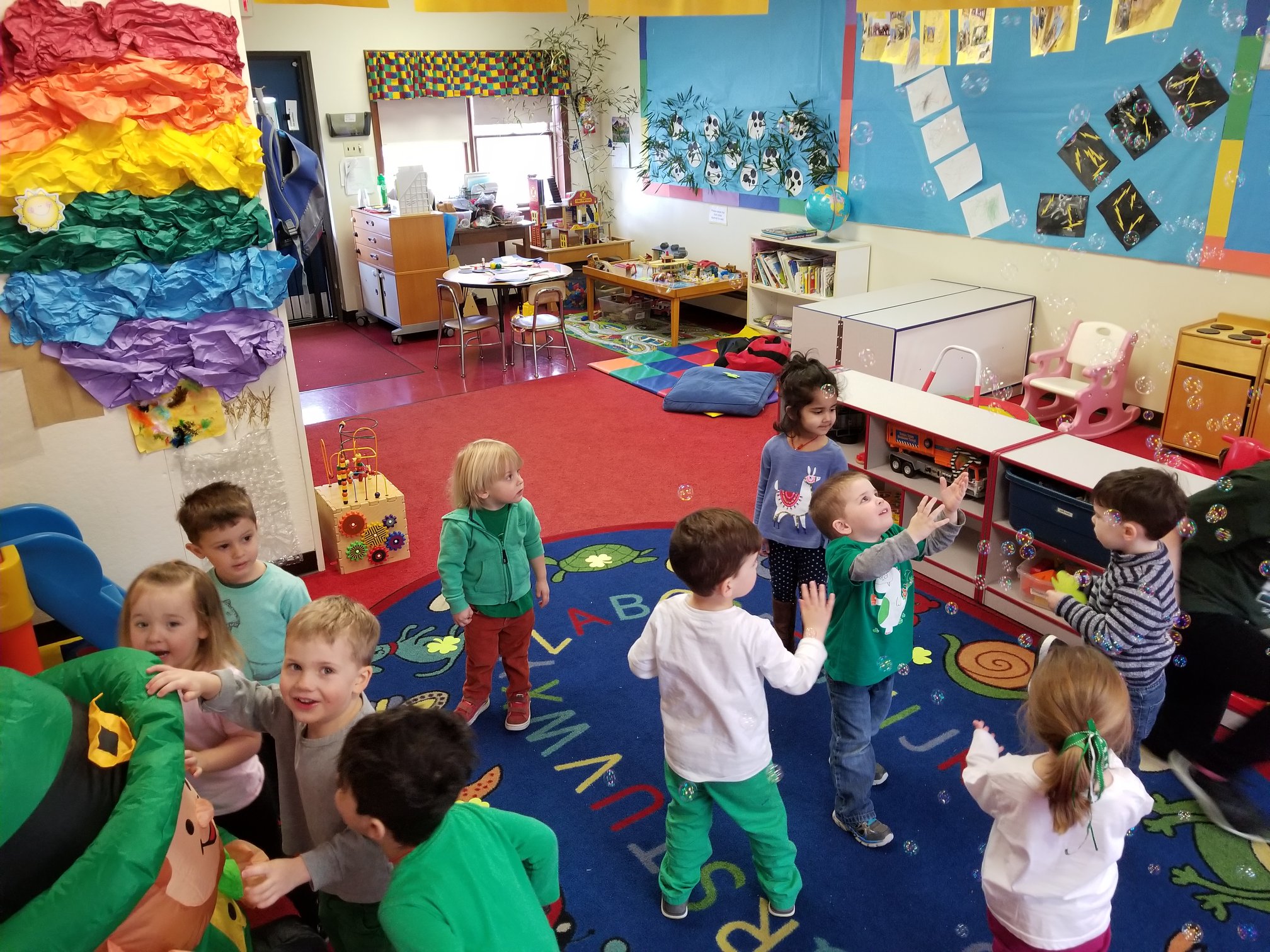 Kids playing in a classroom.