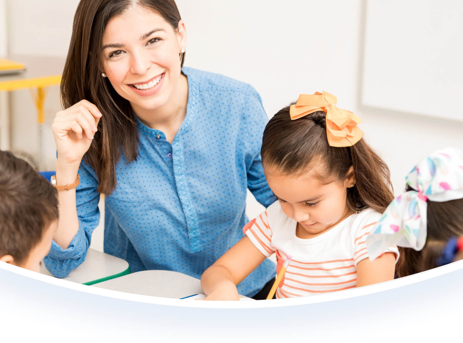 Teacher and young student in class.