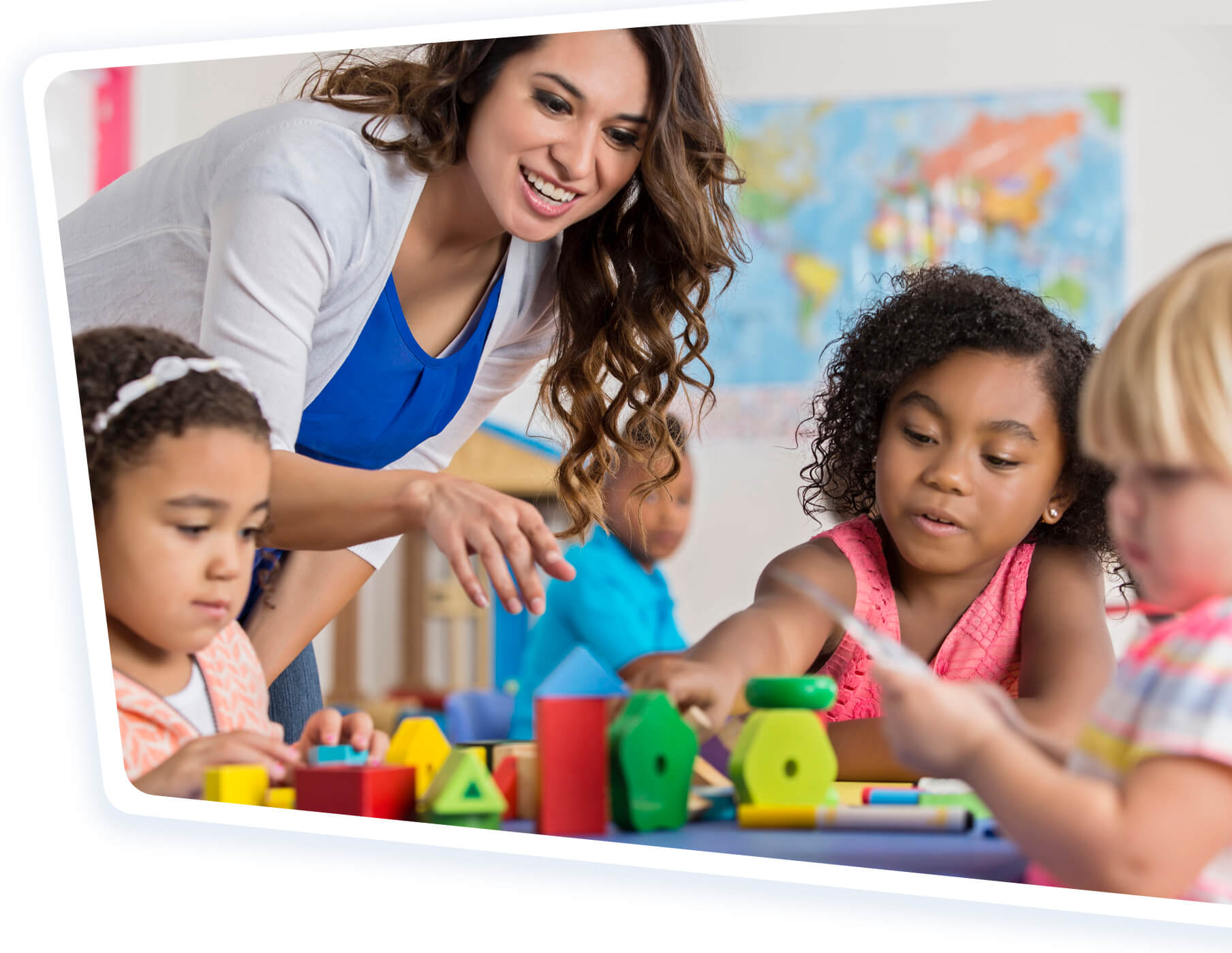 Female teacher helping students.