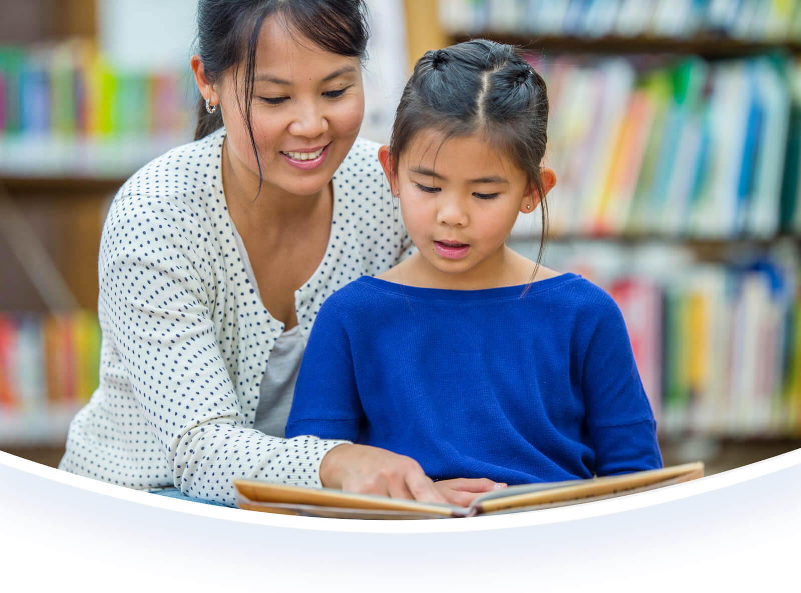 Parent and child in a library.