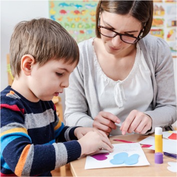 Mother and son in a classroom.