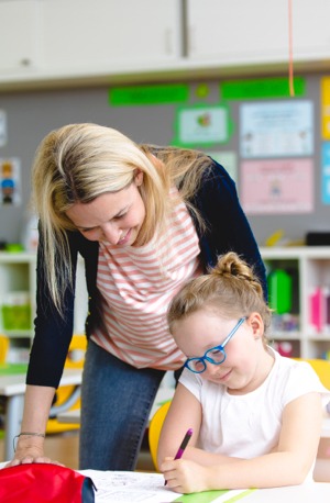 Parent and child in a classroom.