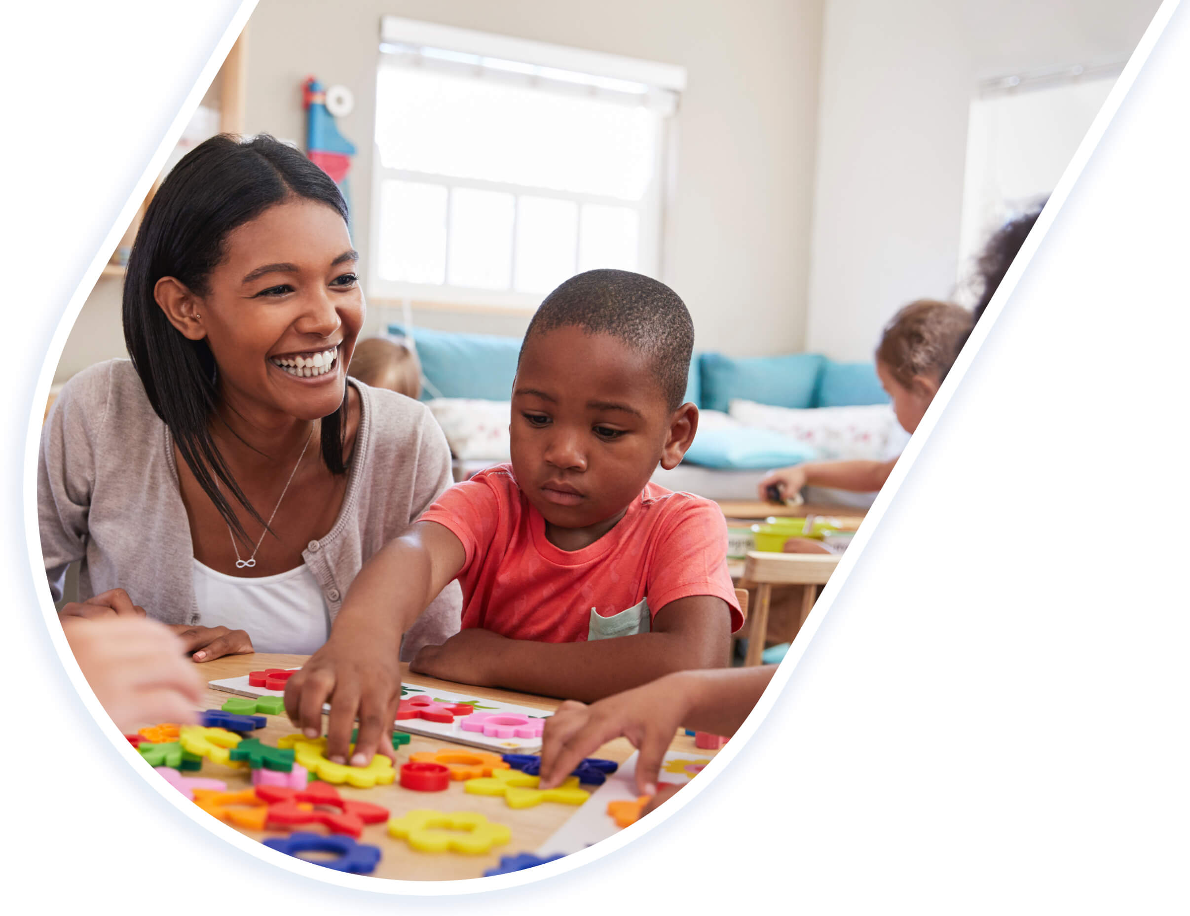 Preschool teacher playing with a student.